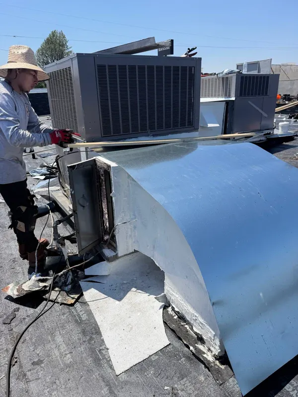 Sheet-metal duct transition on a commercial roof