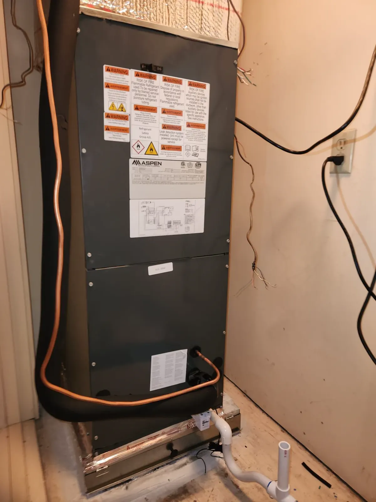 A new heat pump air handler Boost installed in a closet