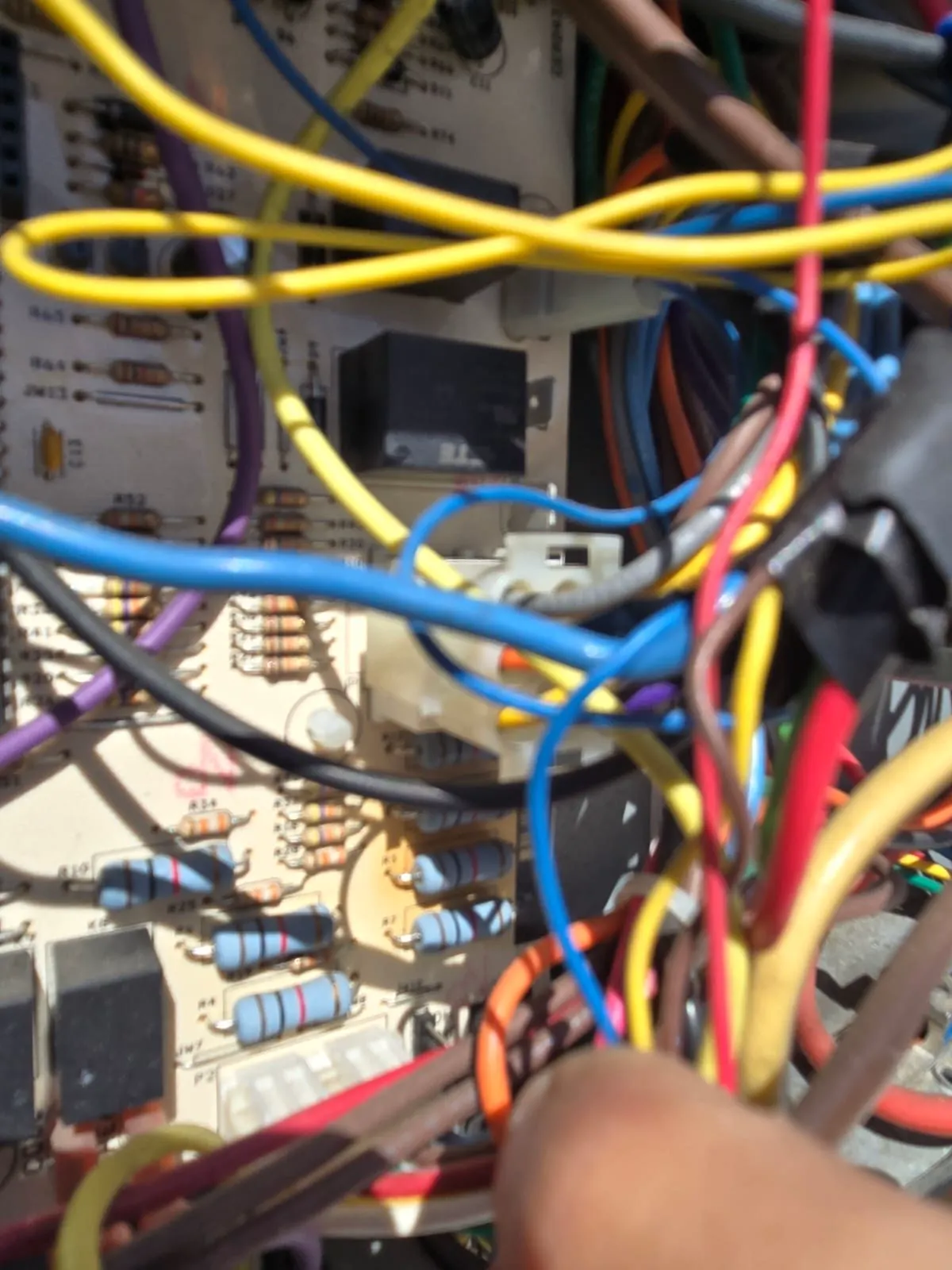 Control board relays and wiring inside an HVAC unit