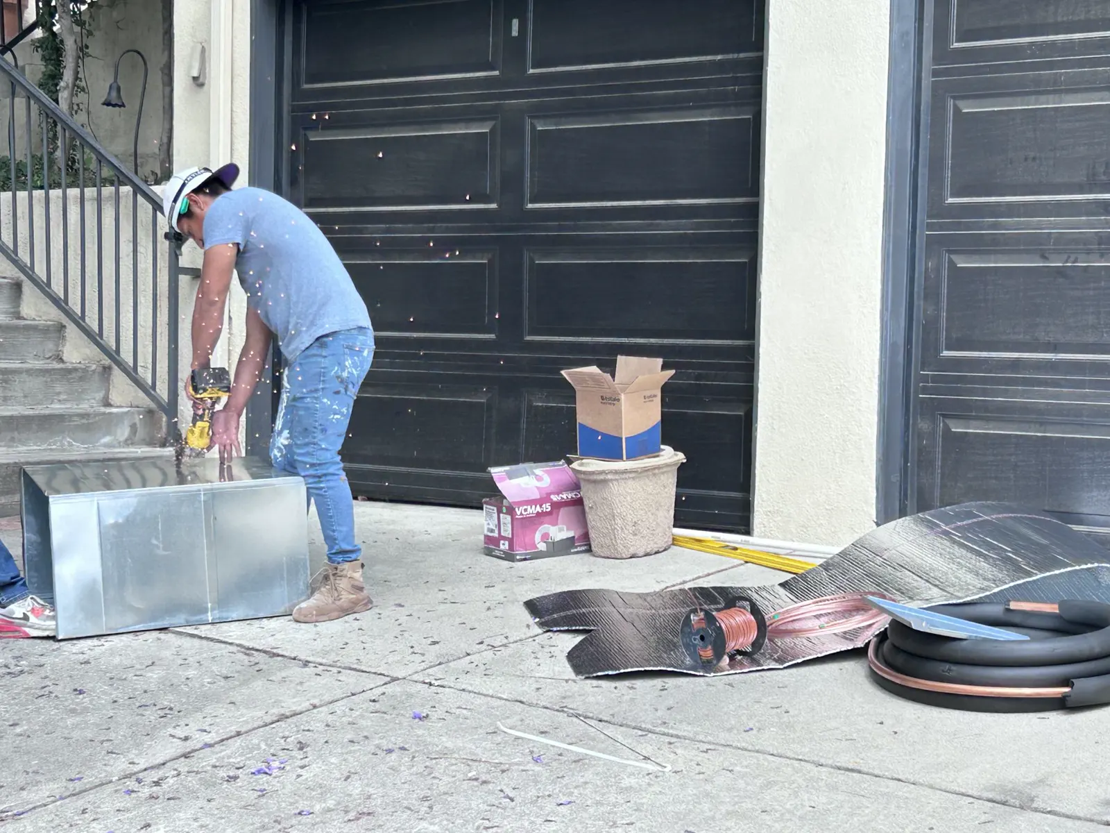 Boost technician fabricating ductwork on site