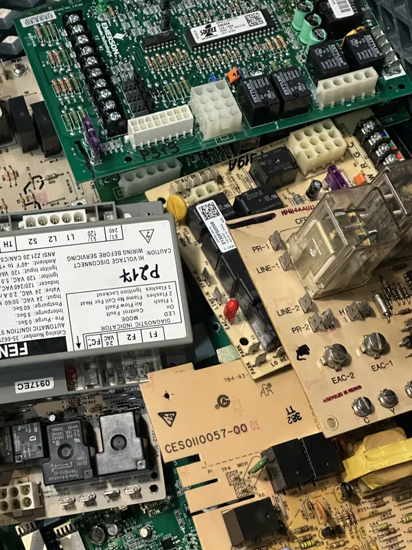 Furnace control boards and an ignition control module from our parts stock