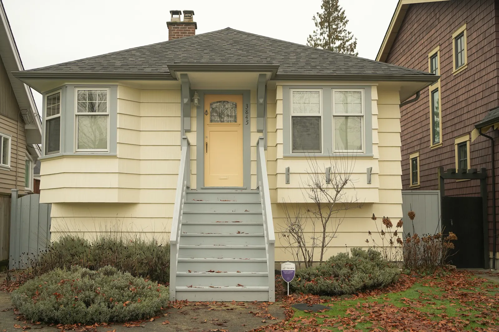 A house with a yellow door and a yellow door