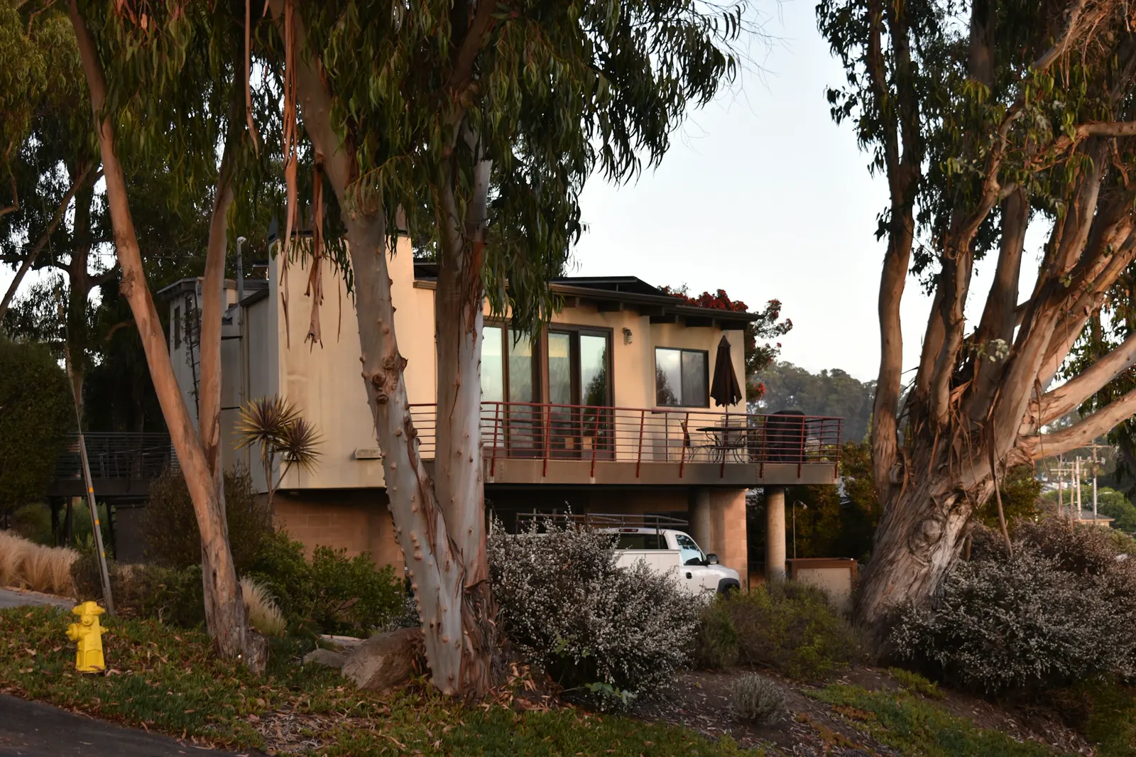 A house with a car parked in front of it