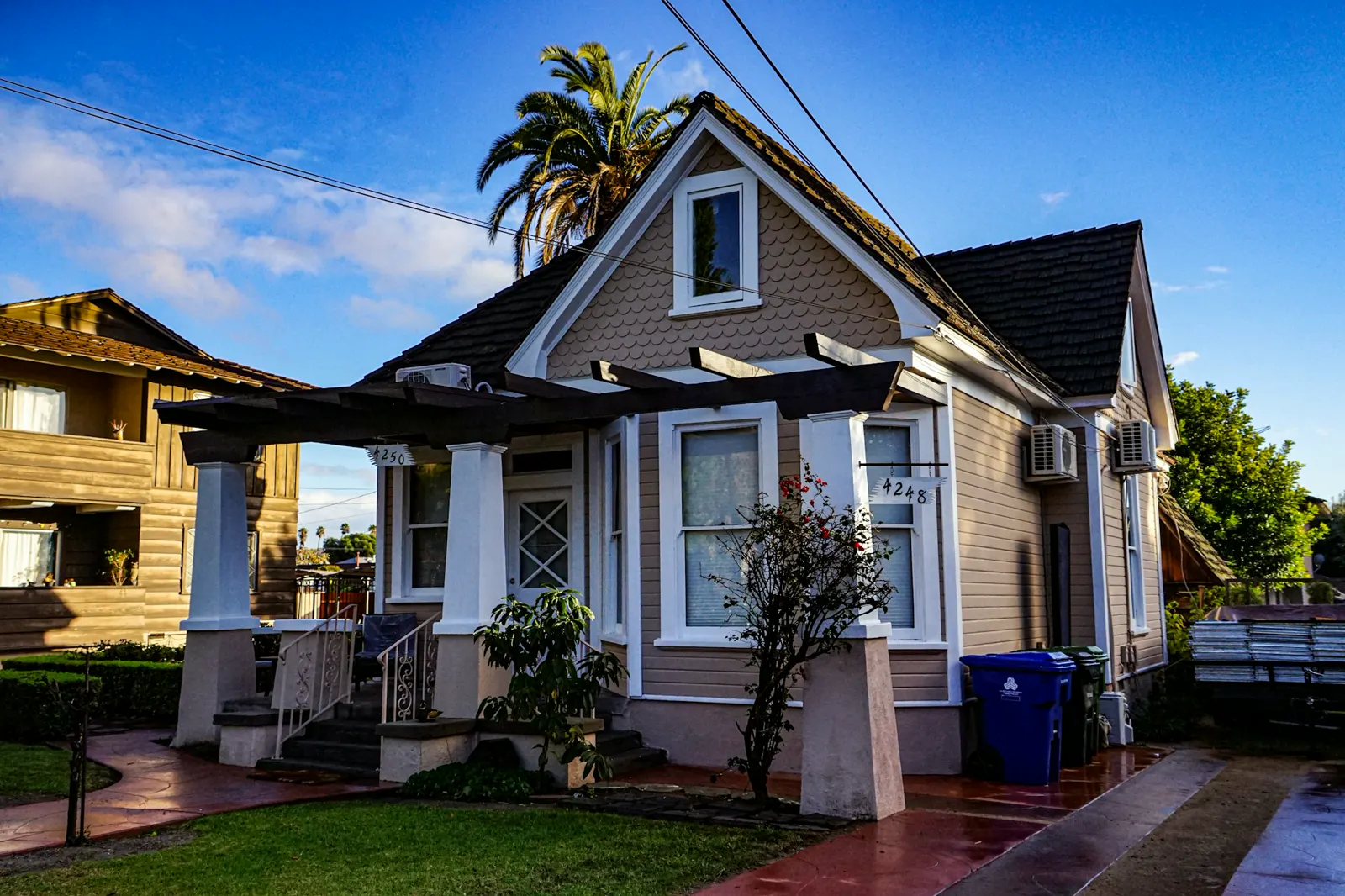 A house with a palm tree in front of it