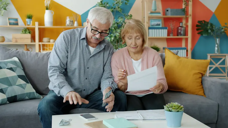 A couple reviewing paperwork together at home