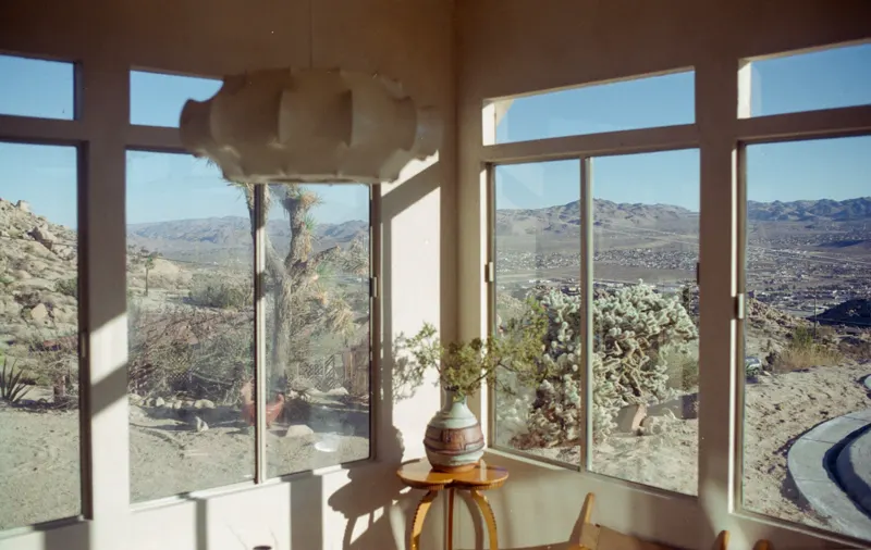 Large windows with a hillside view