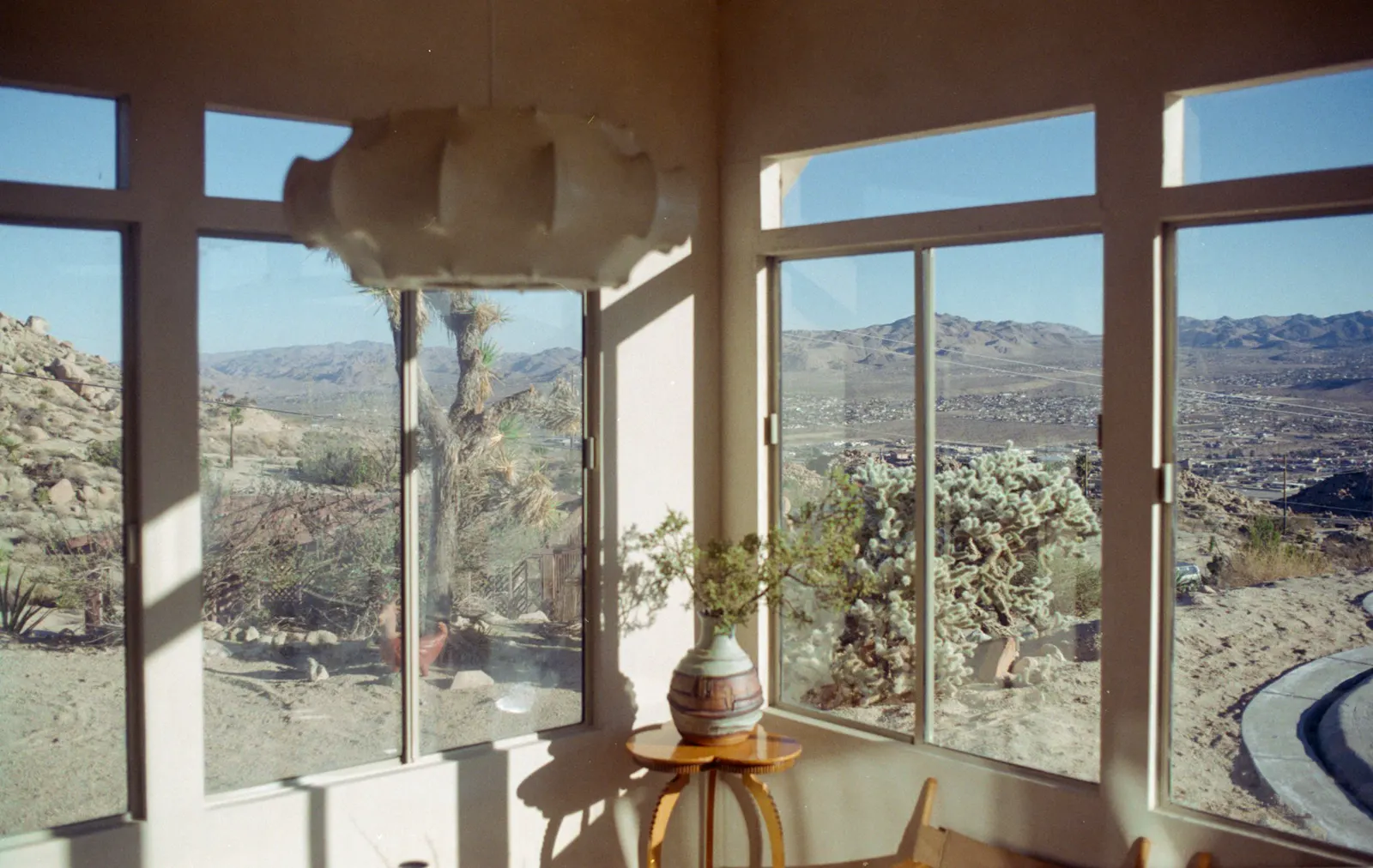 Large windows with a hillside view