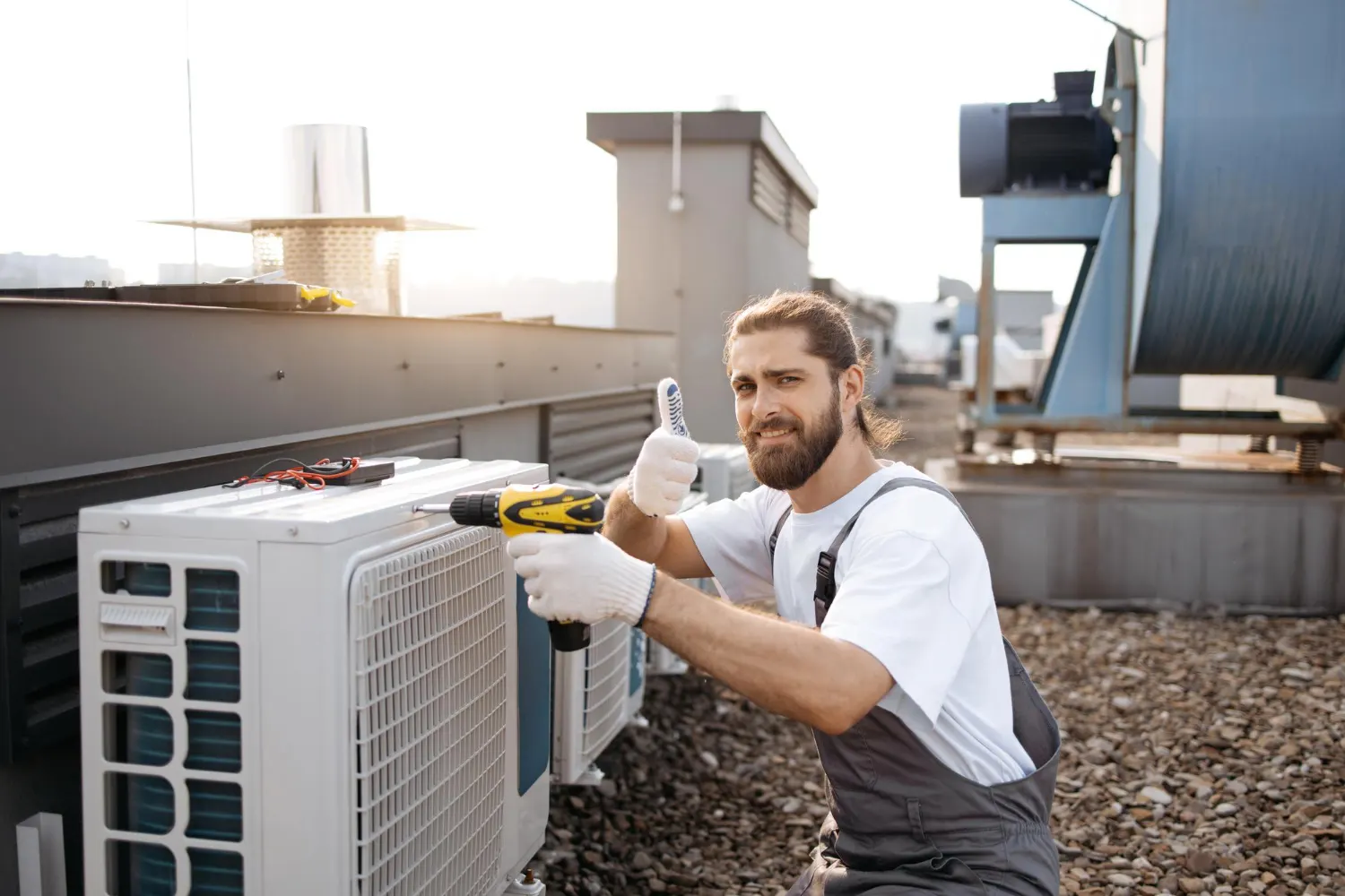 Technician servicing an outdoor air conditioning unit
